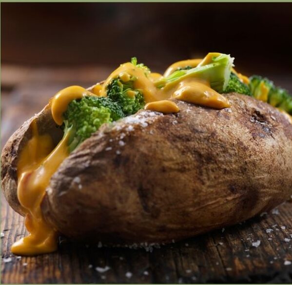 cheezy sauce on a baked potato